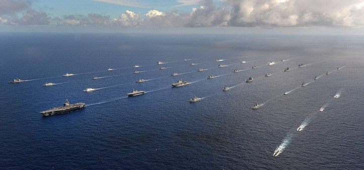 Forty-two ships and submarines representing 15 international partner nations manuever into a close formation during Rim of the Pacific (RIMPAC) Exercise 2014. Image Credit: CC by Stuart Rankin/Flickr.
