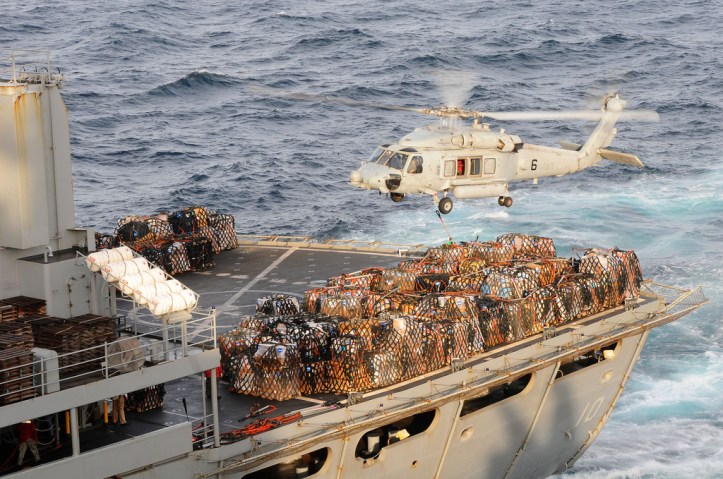 An HH-60H Sea Hawk helicopter assigned to the Black Knights of Helicopter Anti-Submarine Squadron (HS) 4 transfers pallets of supplies from the Military Sealift Command fast combat support ship USNS Bridge (T-AOE 10) during a replenishment at sea. Image Credit: CC by Official U.S. Navy Page/Flickr.