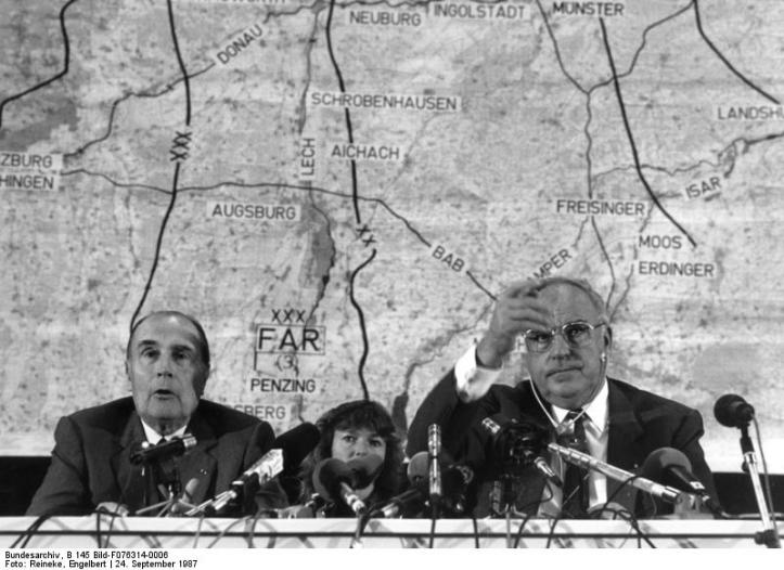 Franco-German reconciliation has been crucial for the success of post-War European integration. On this photo, dated 24 Sptember, 1987, French President François Mitterand and Chancellor of Germany Helmut Kohl address press during joint military exercise. Image Credit: Wikimedia Commons